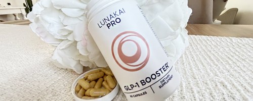 lunakai bottle with pills in lid next to it