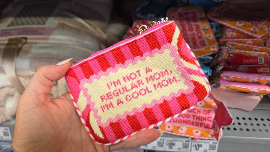 hand holding i'm not a regular mom i'm a cool mom needlepoint wristlet