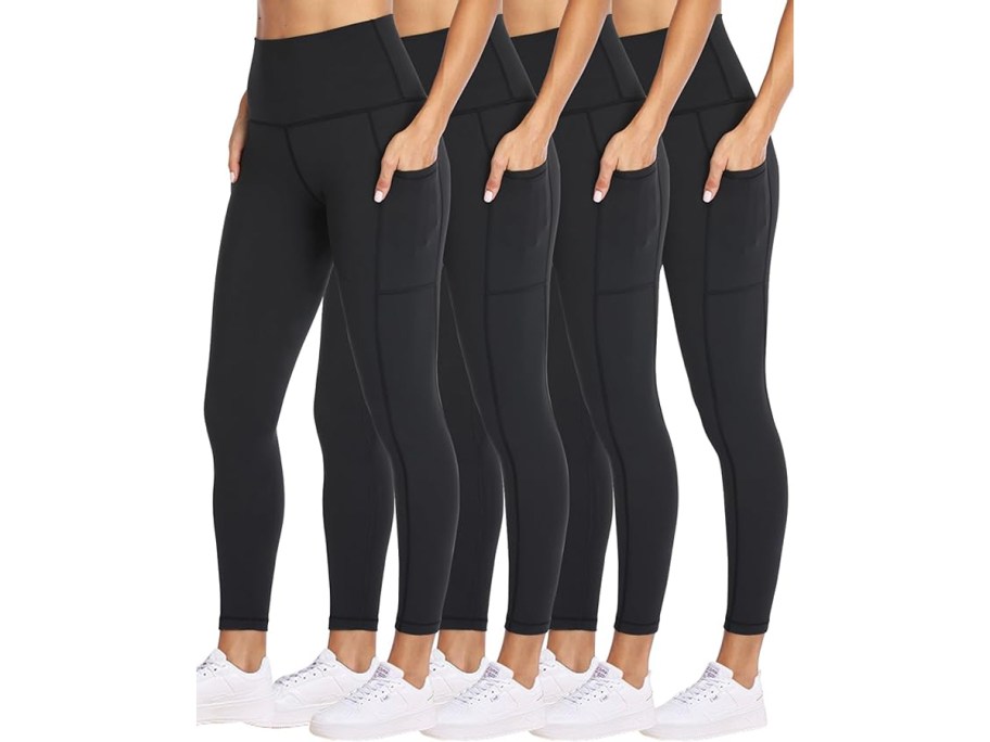 four women wearing black leggings 