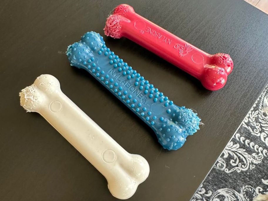 three nylabones on table