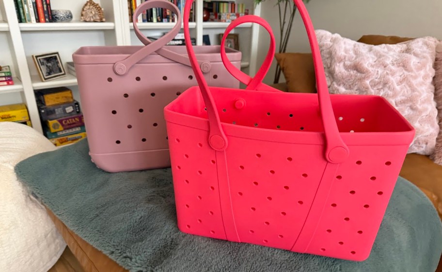 dusty pink and bright pink bogg bags on blanket