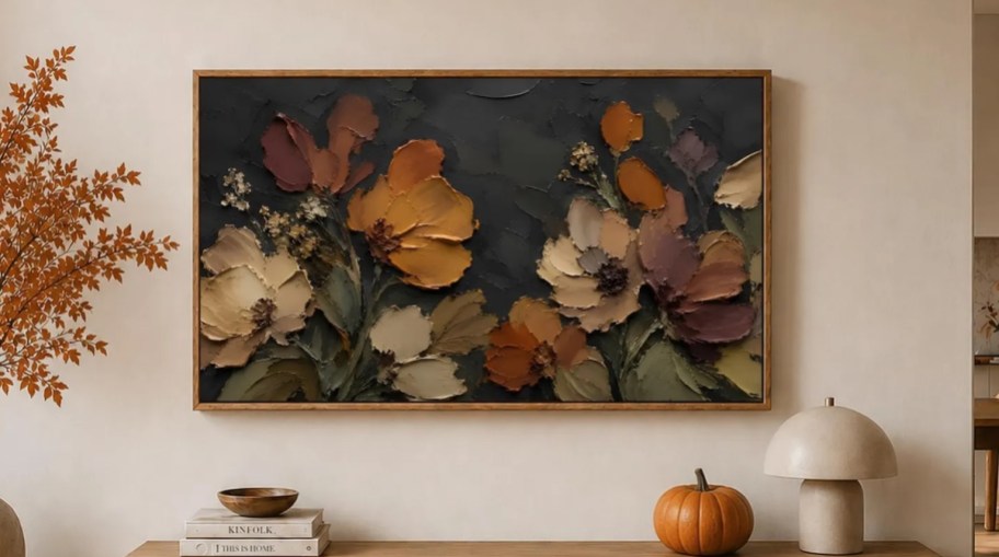 floral artwork on tv hanging on wall