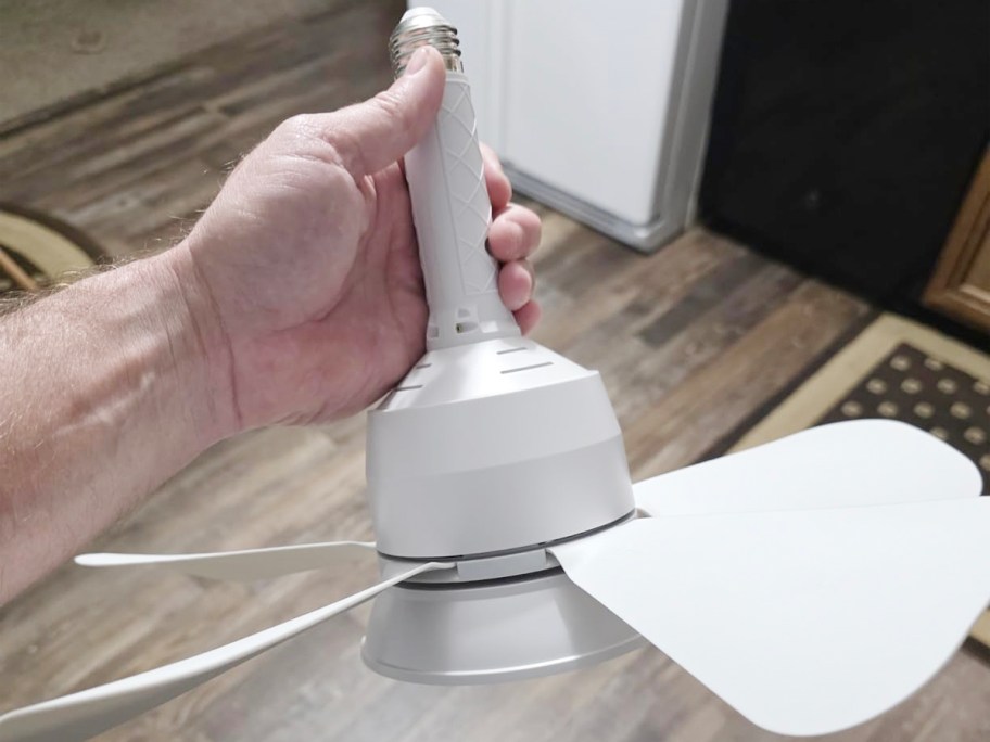 White socket holding ceiling fan 