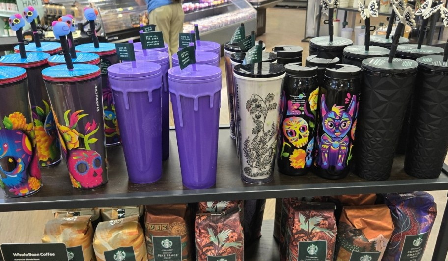starbucks halloween tumblers on a store shelf