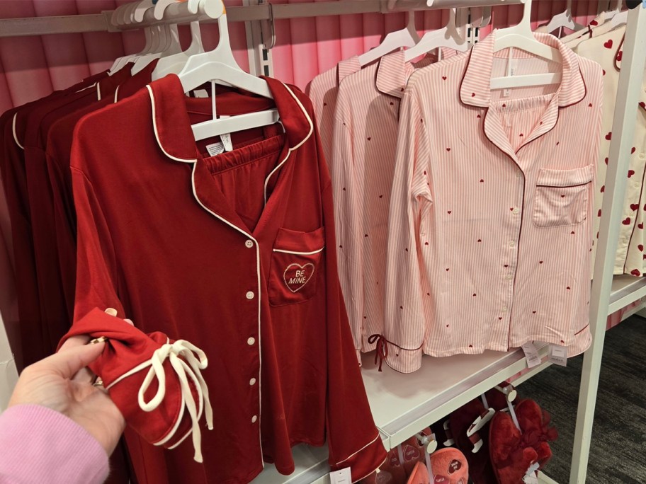 red and pink valentines day pajamas hanging in store