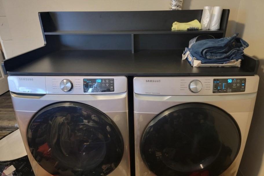 a black 2 tier washer and dryer countertop