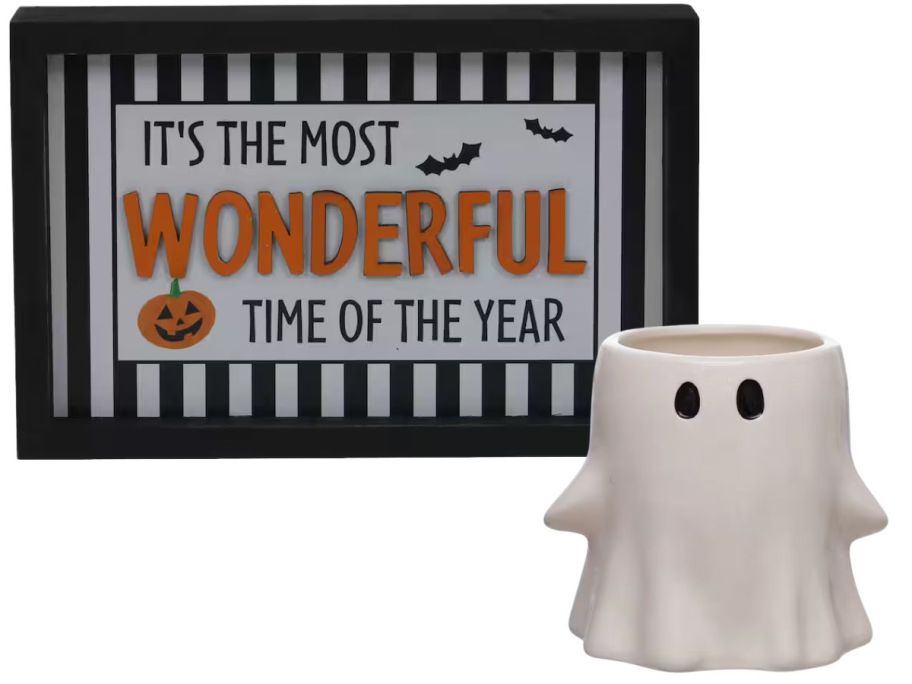 A Halloween table top sign and a ceramic ghost