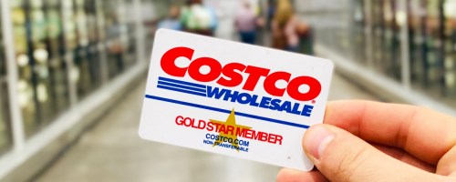 hand holding up a Costco gold star membership card