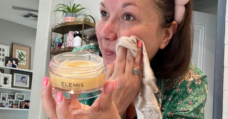 Woman using an Elemis Cleansing Balm on her Face