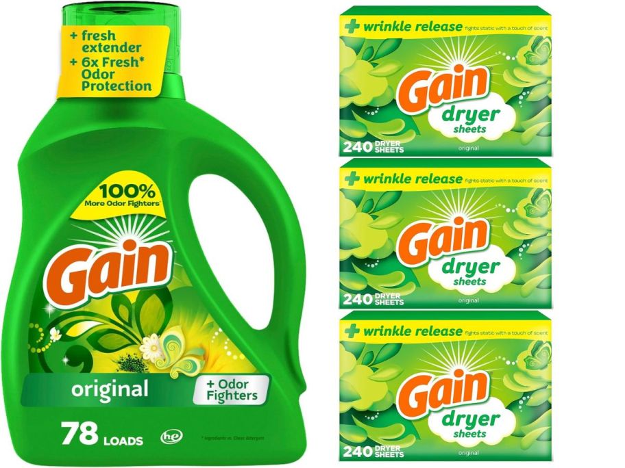 A bottle of Gain detergent beside 3 boxes of Gain dryer sheets