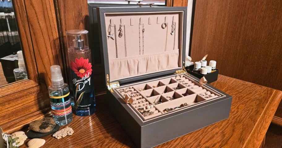a jewelry box open on a dresser