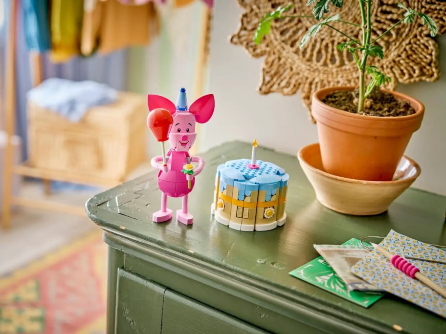 A complete LEGO Piglet birthday set on a table.