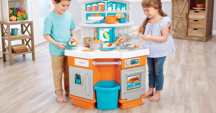 kids playing with a Little Tikes Home Kitchen Play Set