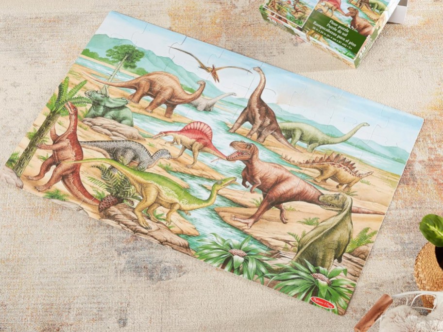A Melissa & Doug dinosaur floor puzzle.