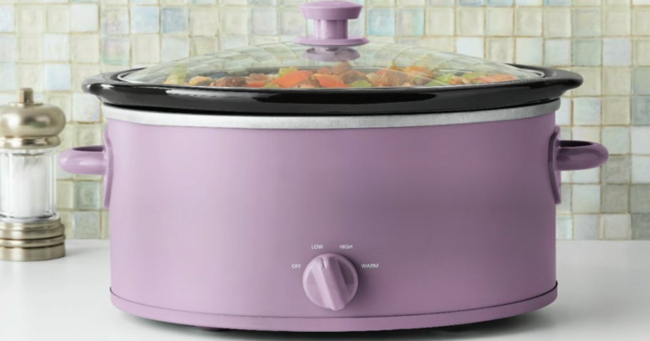 Purple slow cooker on kitchen countertop