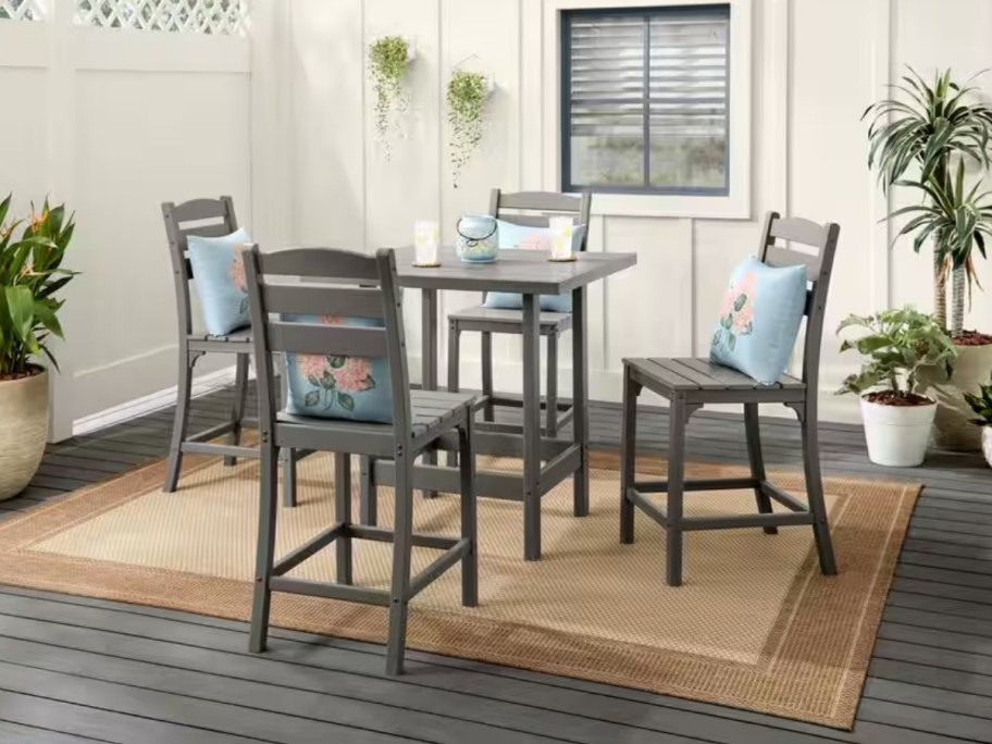 a gray 5 piece outdoor counter height dining set