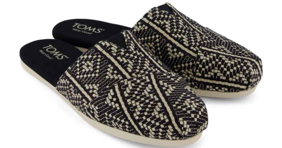 A pair of back and tan shoes