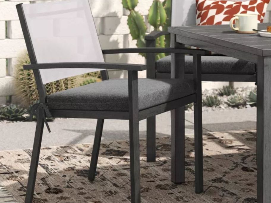 Threshold 18"x20" Solid Woven Outdoor Chair Seat Cushion on chair on patio