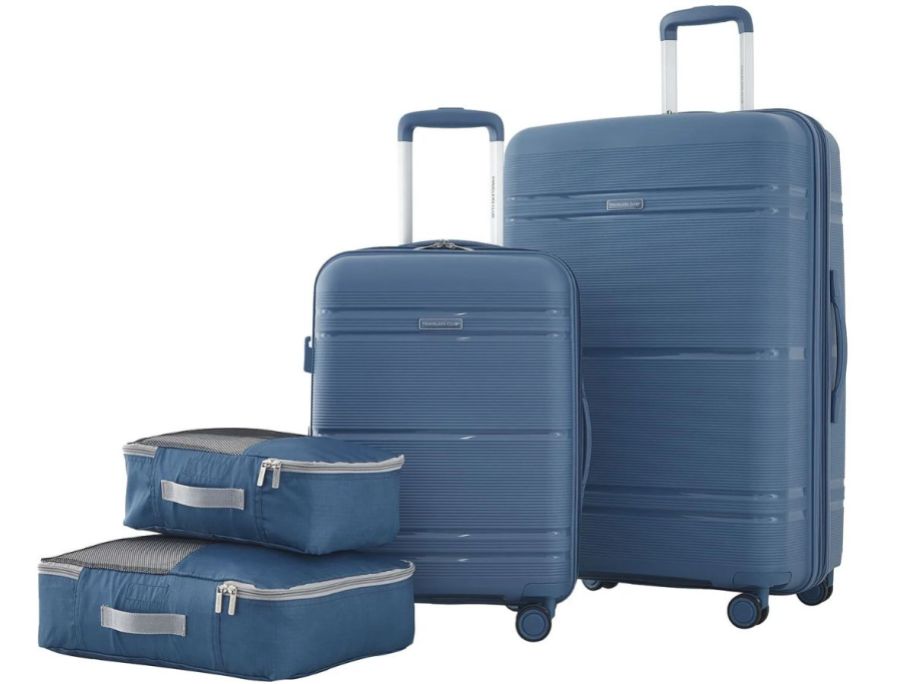 two Travelers Club Harside Suitcases and two packing cubes