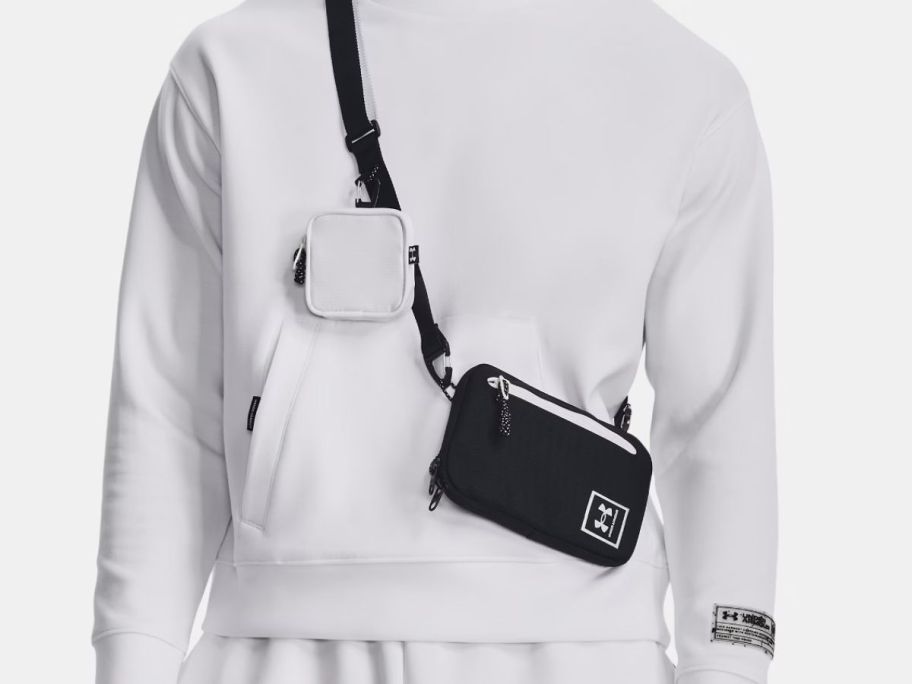 A person wearing a black crossbody bag