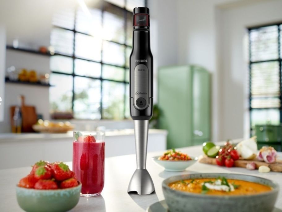 A Philips hand blender on a counter