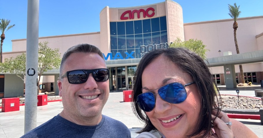 woman and man outside an AMC Movie Theater