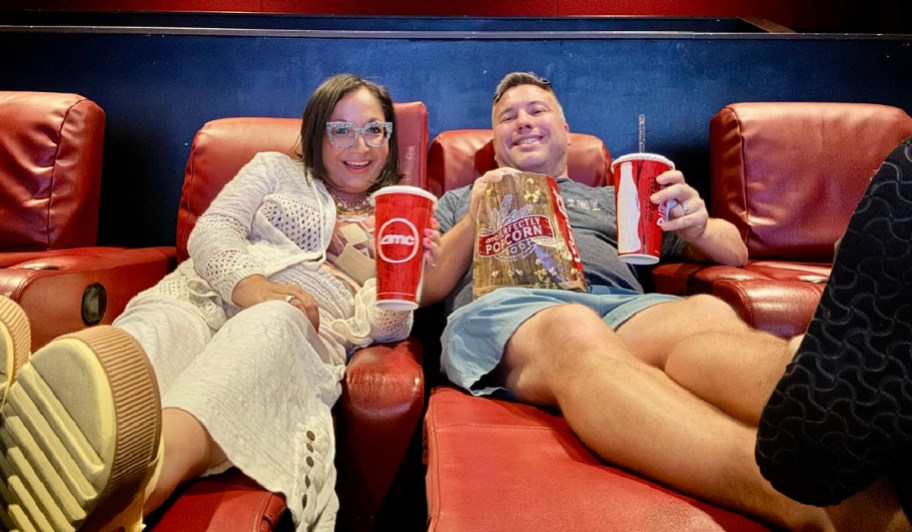 woman and man sitting in an amc theater