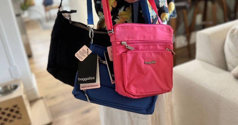 woman wearing several baggallini crossbody bags