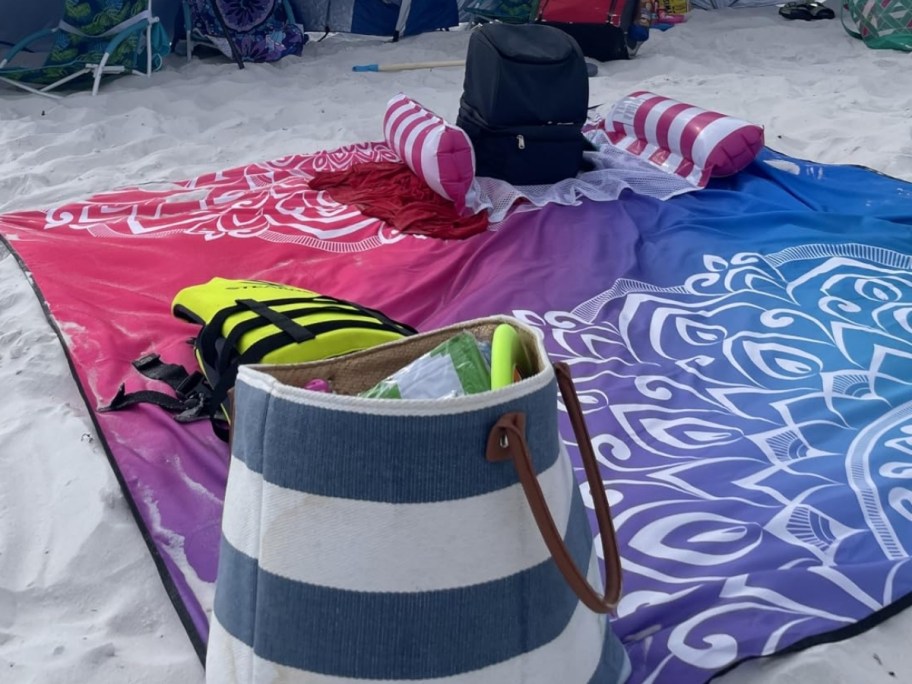 a beachblanket set up on the beach