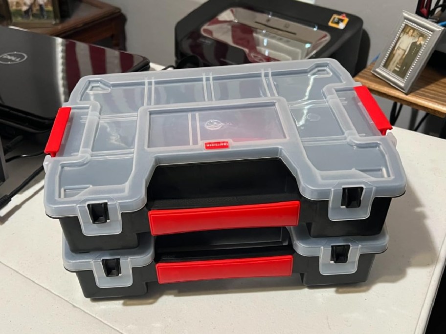 Two Craftsman tool organizers on a table.
