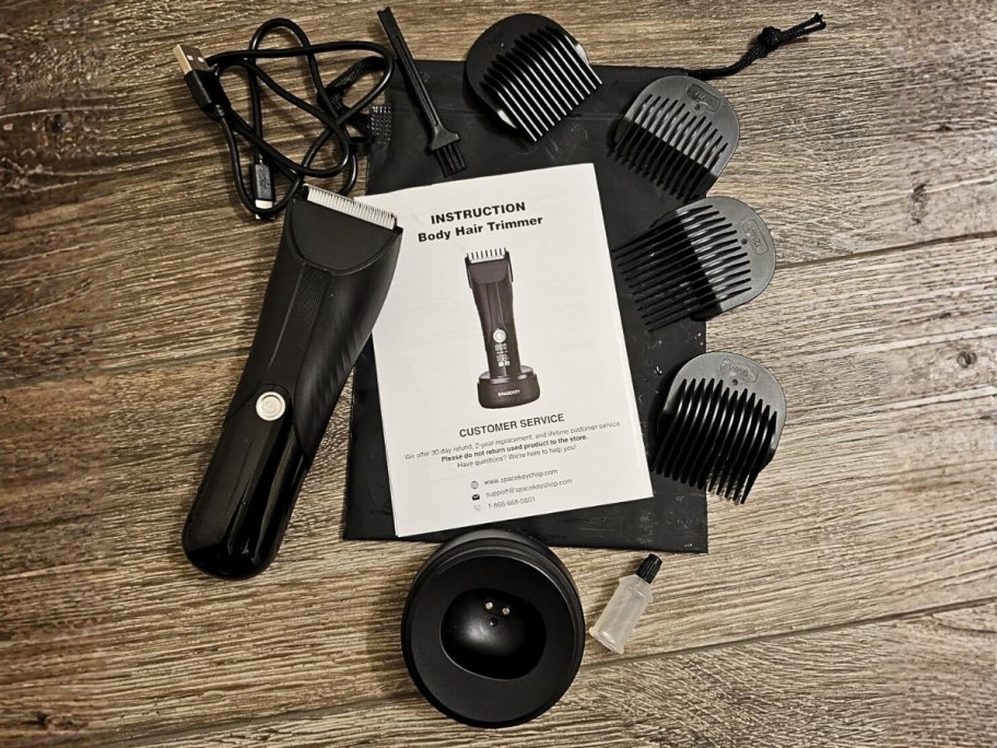 an electric trimmer shown with guards and cord