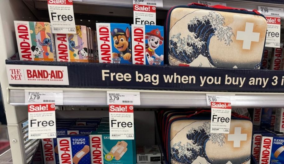 two first aid kits on store shelves displayed with character band aids 
