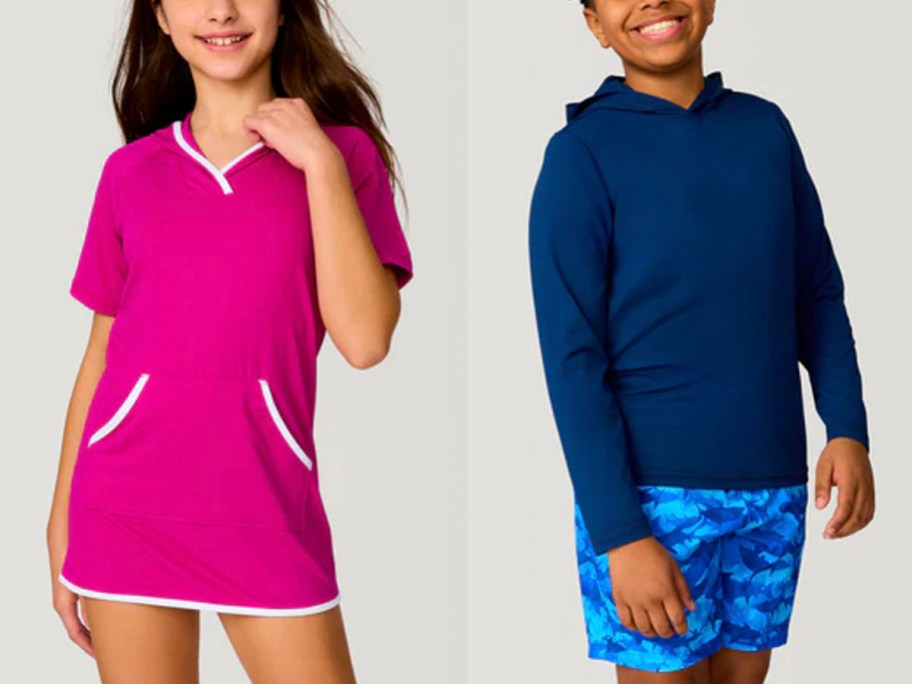 woman wearing pink swimdress and boy wearing long sleeve swim shirt