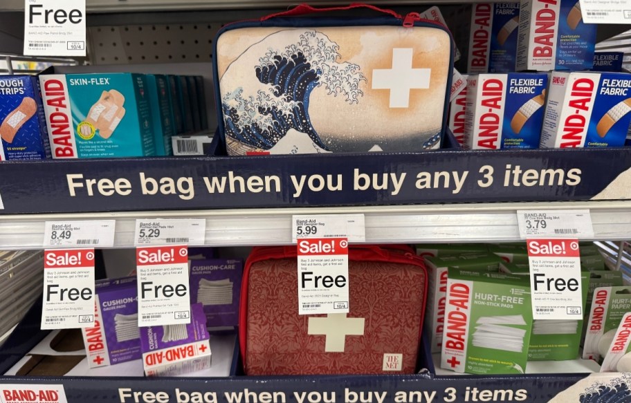 two first aid kits on store shelves displayed with band aids and other first aid items