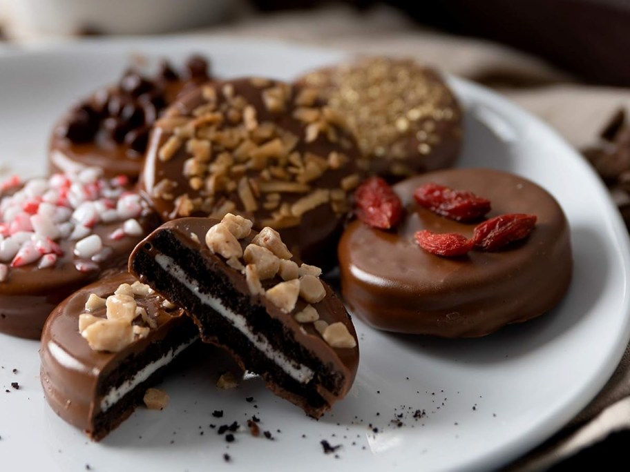 chocolate covered cookies on a white plate