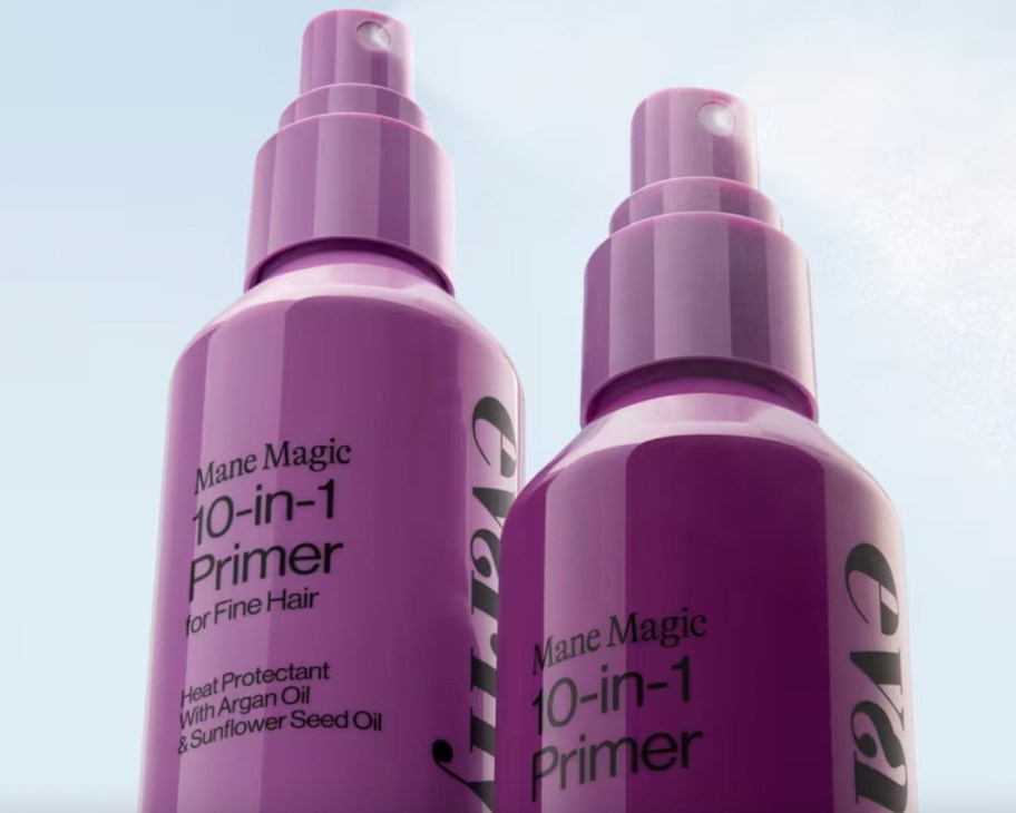 two bottles of purple hair spray