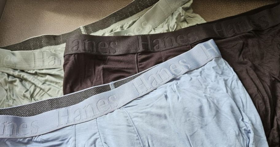 three men's boxer briefs