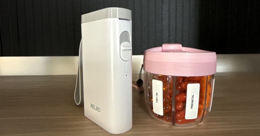 nelko label maker on counter next to pill organizer