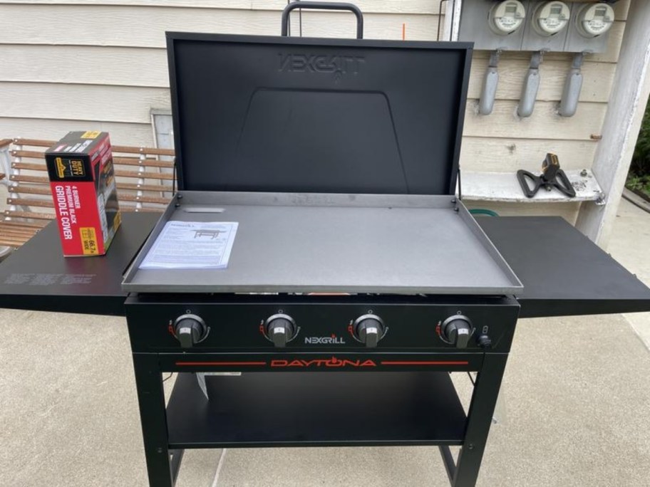 a 4 burner gas griddle with lid raised