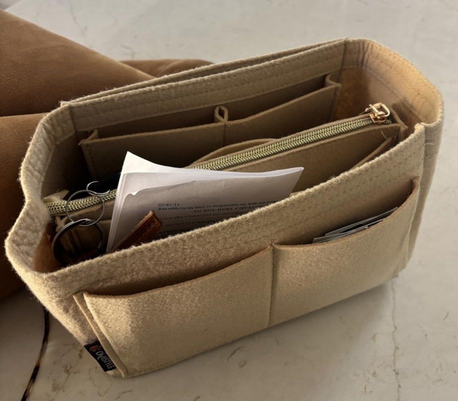 beige purse organizer on a tabletop