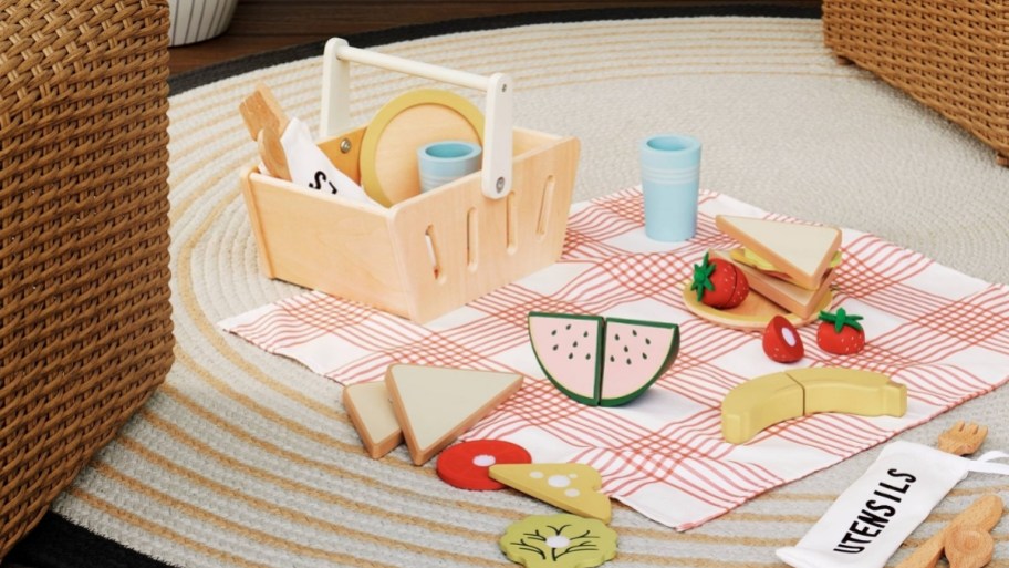 picnic basket playset on a rug.