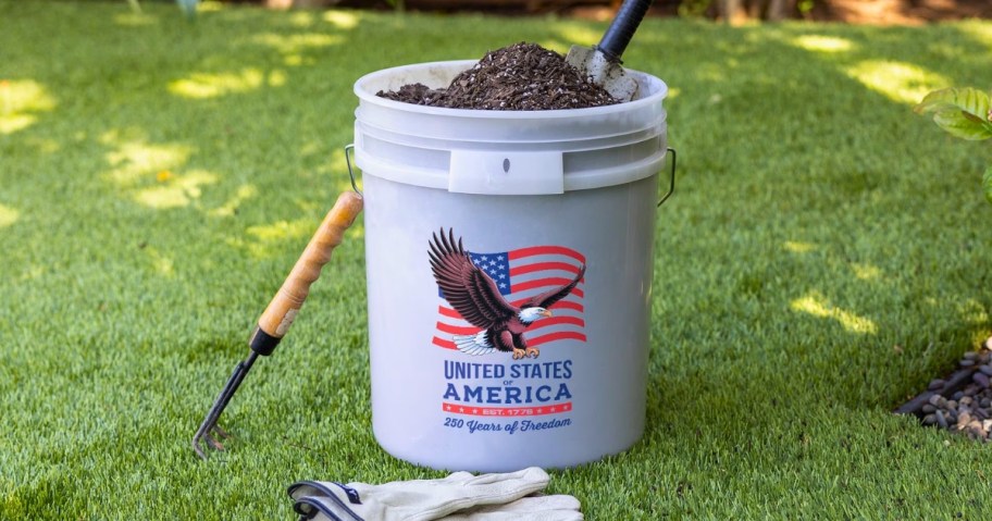 a white five gallon bucket with the USA Flag, a Bald Eagle, and America's 250th anniversary on it