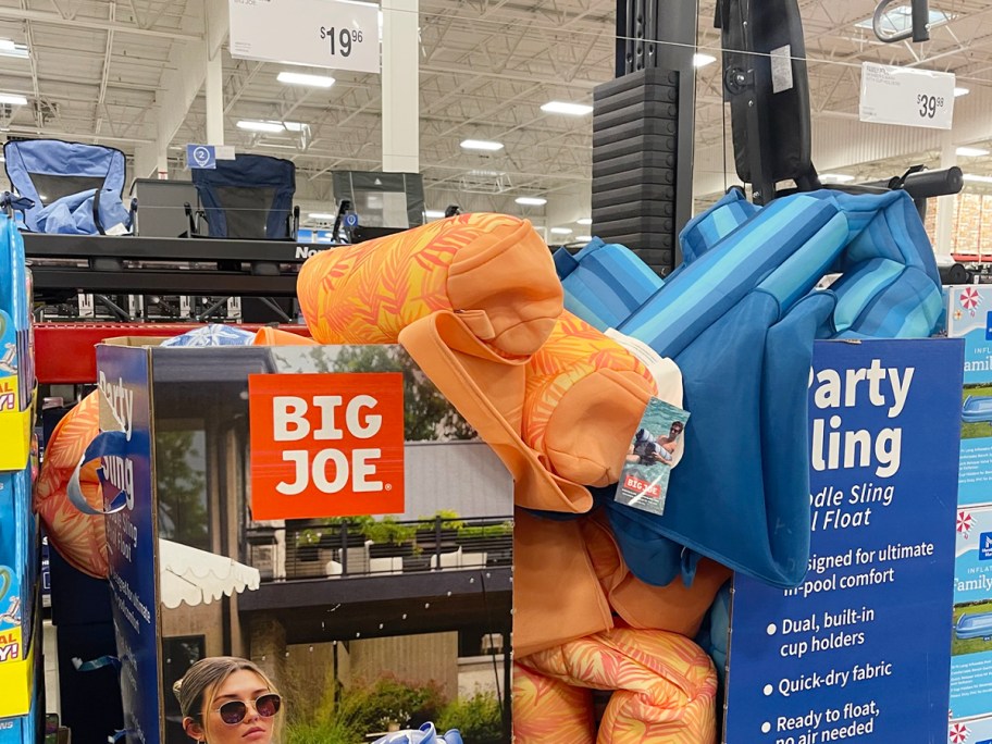 orange and blue pool floats in box