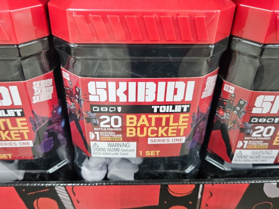 a Skibidi Toilet battle action figure bucket on a store shelf
