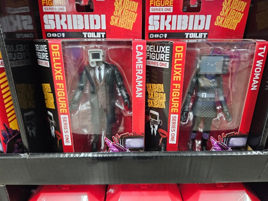 two Skibidi Toilet action figures in packaging on a store shelf