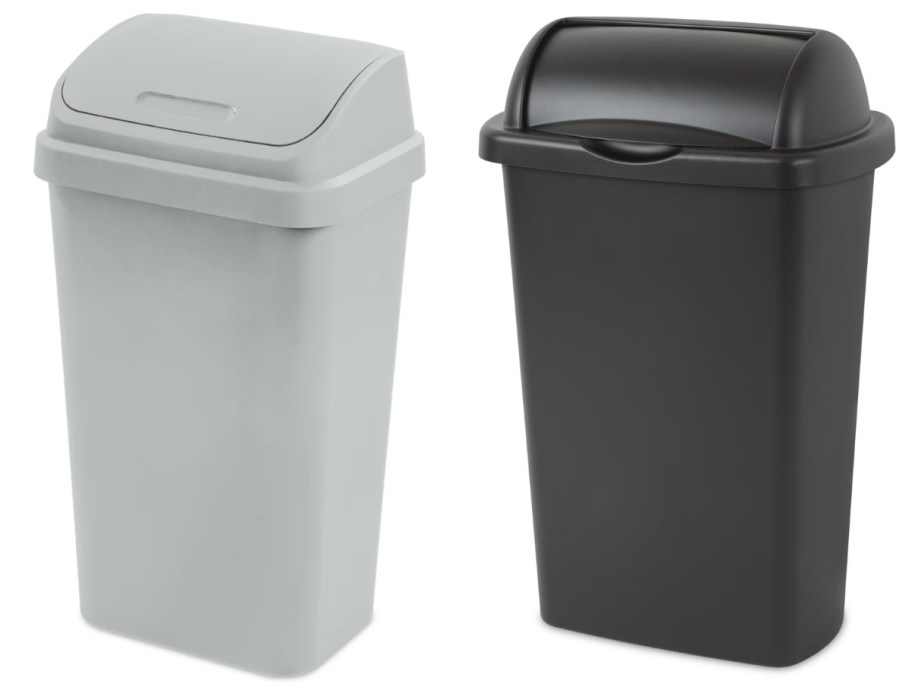 a grey flip top kitchen trash can and a black roll top kitchen trash can