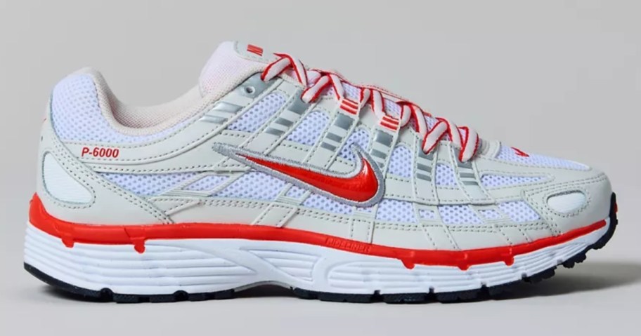 a blue, red, and white women's Nike sneaker