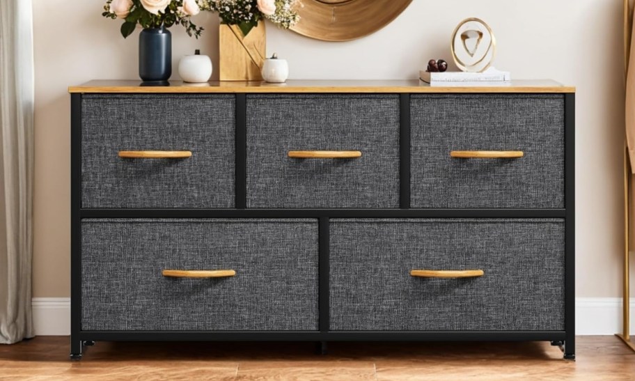 a five drawer dresser used as a console table