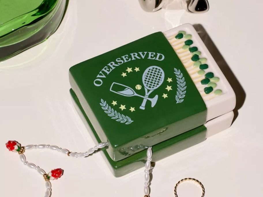 a small jewelry box with a pickleball paddle and ball design