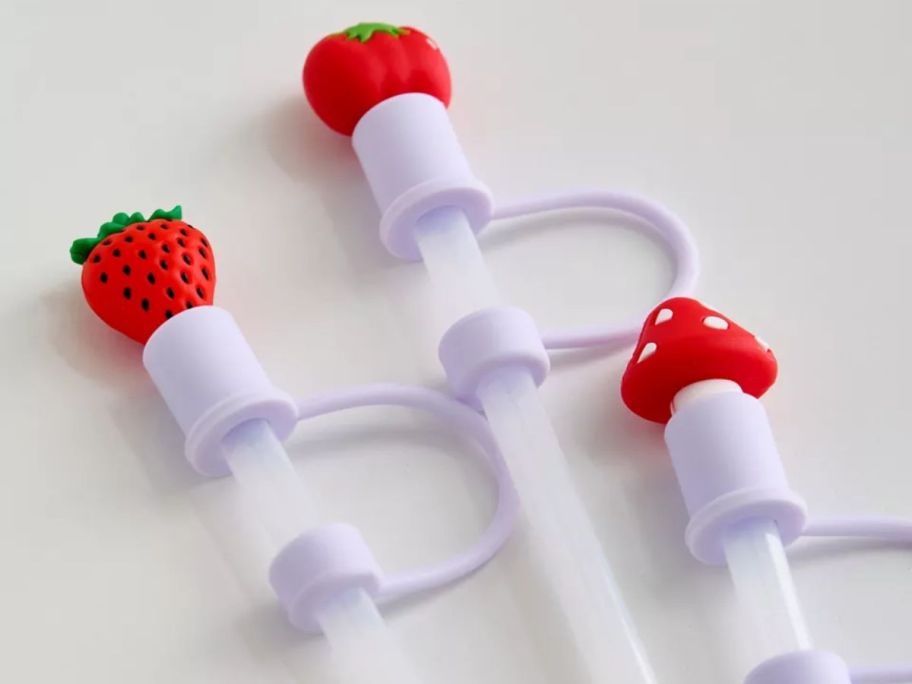 straws with fruit and mushroom straw toppers